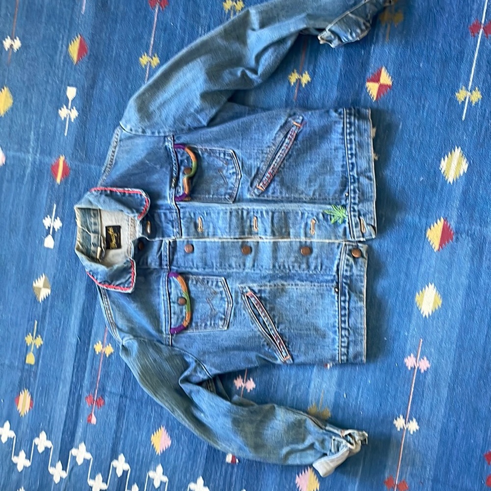 cool vintage wrangler jean jacket with embroidery, patches, stud detail. 70s